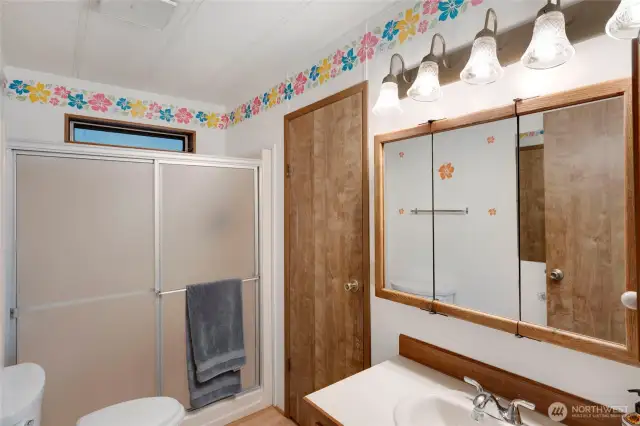 The hallway bathroom has a second entry into the Utility Room off of the carport.