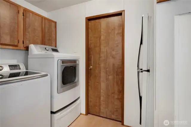 The Utility Room is off of the carport entry; door in the middle leads to the hall bathroom.
