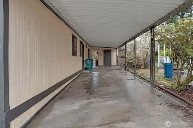 Room for two cars in the carport...