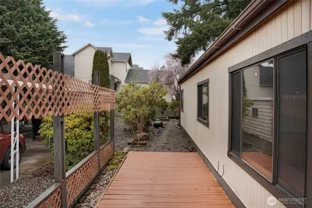 An uncovered deck continues past the covered porch at the entry that doubles your grilling/entertaining space!