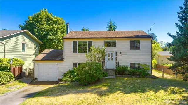Large front yard, one car garage, driveway parking, street parking & RV parking