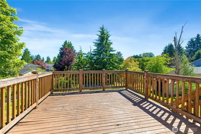 large deck off the kitchen overlooking the yard ready for BBQ's