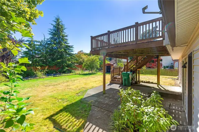 shaded patio below large porch for enjoying your yard on those hotter days