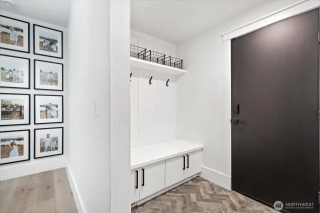 Garage entry way; places for coats, shoes and cares of the day