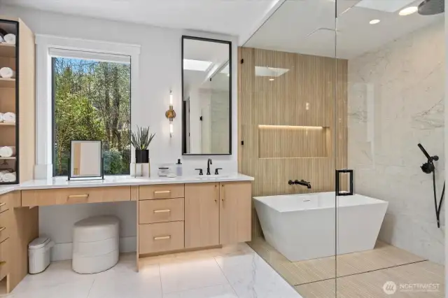 Makeup in natural light in a primary bath you'll want to lounge in.  Showersuite keeps your splashes to yourself!