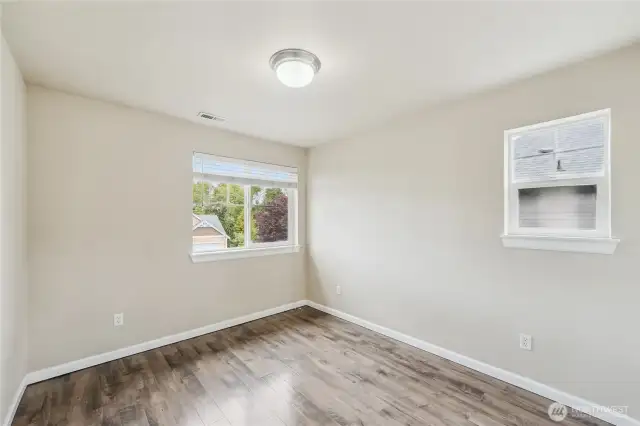 Bedroom is on the corner and has 2 windows.