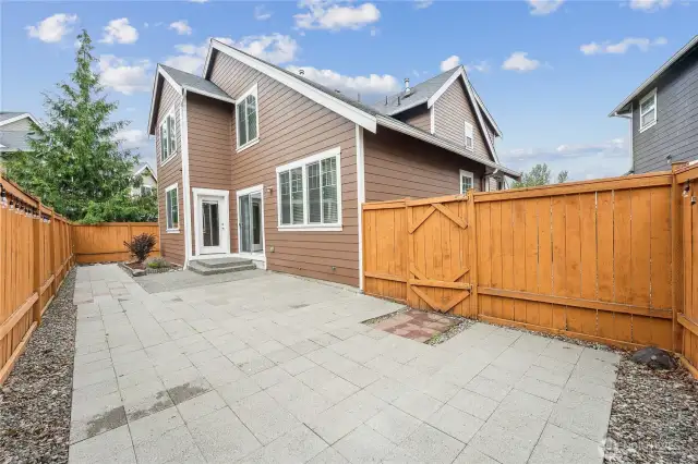Large easy to maintain patio with plenty of room for a BBQ and table/chairs.