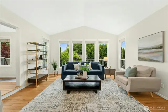 Upon entering, you will be greeted by this captivating, sun-drenched living room!
