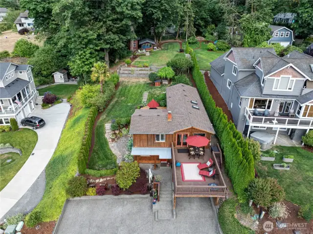 The lot size and location of the home is what makes this such a special and rare find! The dimensions of this .31 acre lot are approximately 65' W x 208' L providing space to make changes to fit your needs or just utilize the back for play, entertaining and or enjoying more privacy.
