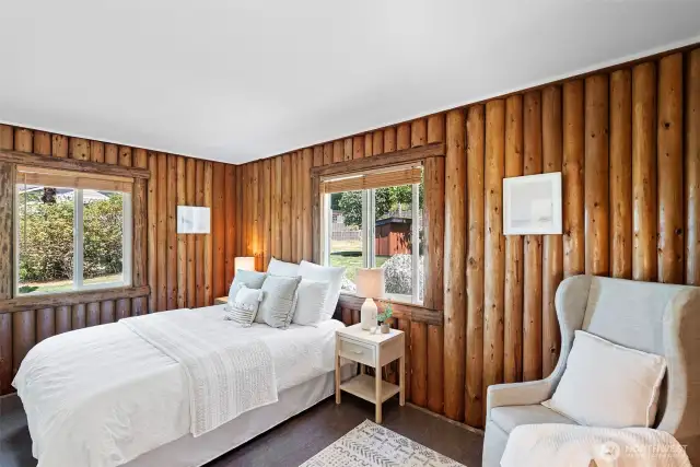 Bedroom 2 on upper level off the back of the home. Windows on multiple walls offers nice cross ventilation and light.
