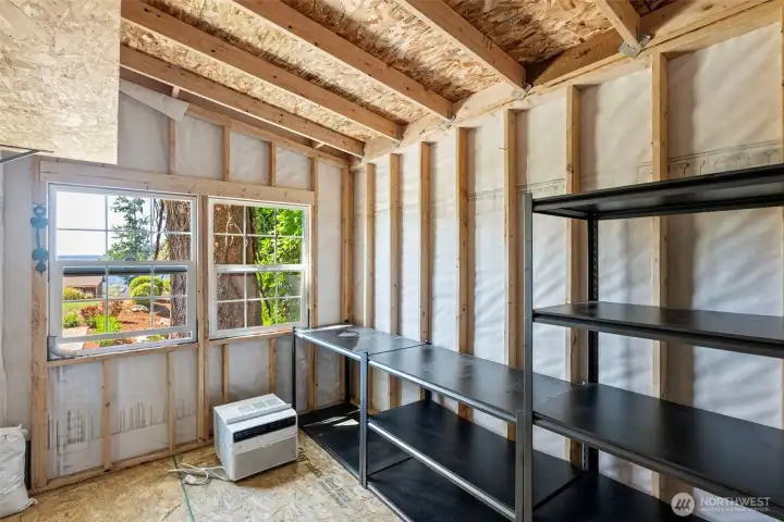 Interior views looking out from the garden shed and small shop.