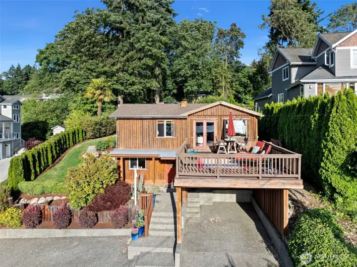 Carport under deck and 2 cars can park in front.