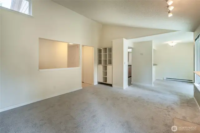 Entry to left, below clerestory window. Hallway leads left to bedrooms.