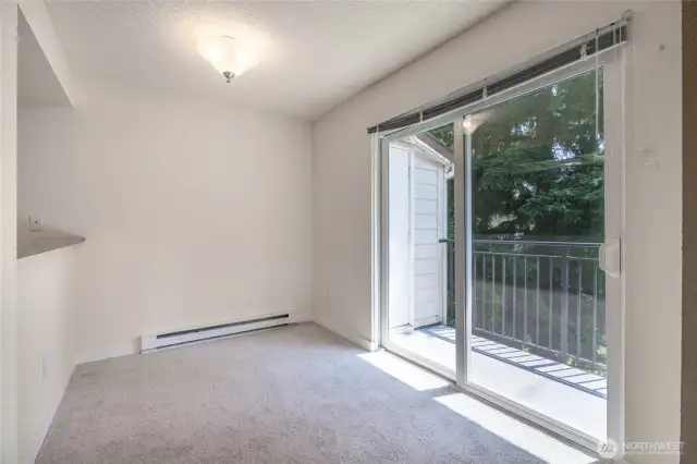 Sliding doors lead to deck with storage closet.