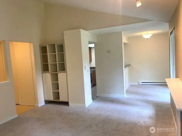 Open concept living space with southern-facing windows.