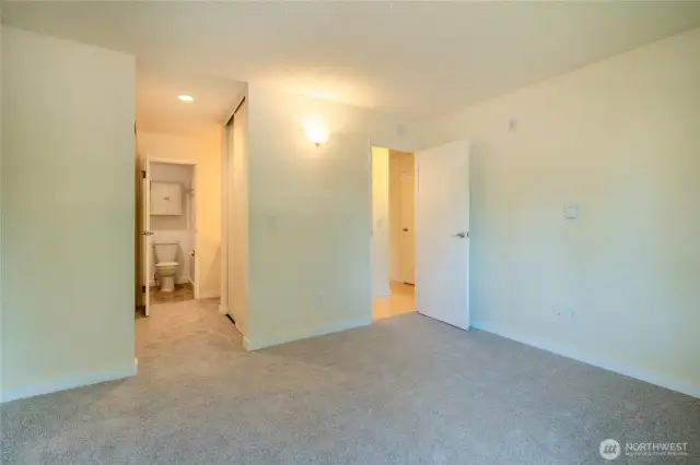 Main bedroom opens onto bathroom with two closets.
