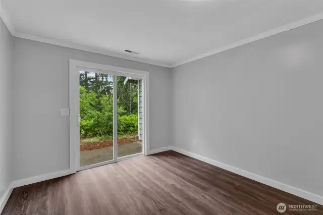Bedroom 4 has slider leading to backyard.