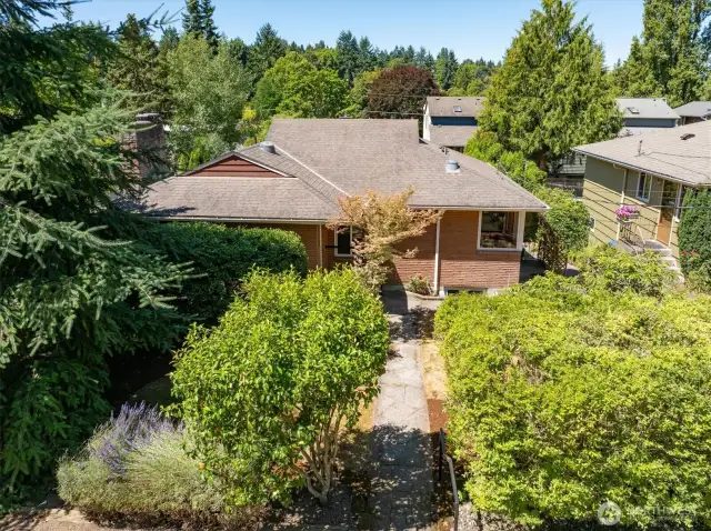 A quiet, neighborhood street leads to this brick Matthews Beach home.