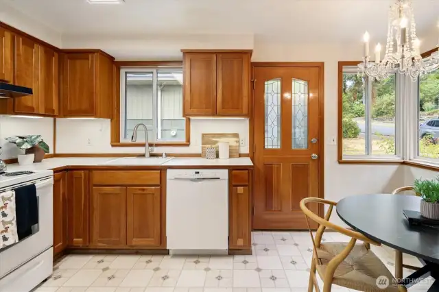The kitchen gets nice natural light and allows for access to the side yard and the backyard.