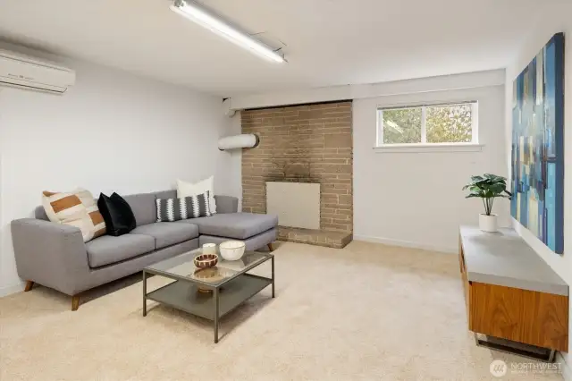 The lower level features brand new carpet and a mini split for heat and AC.  The fireplace was closed off as the seller never used it.