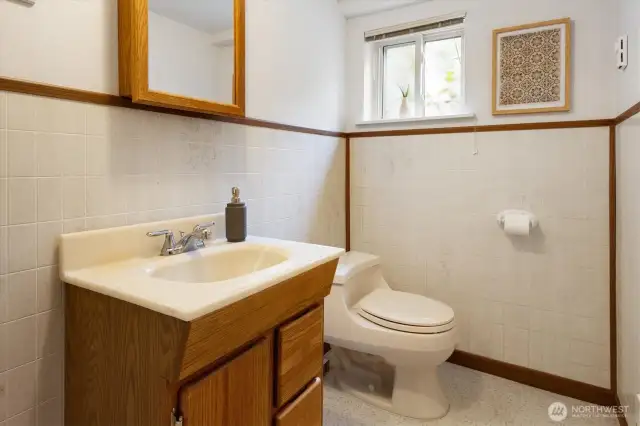 The lower level features a half bath.  It is perfectly located between the rec room and the fourth bedroom.