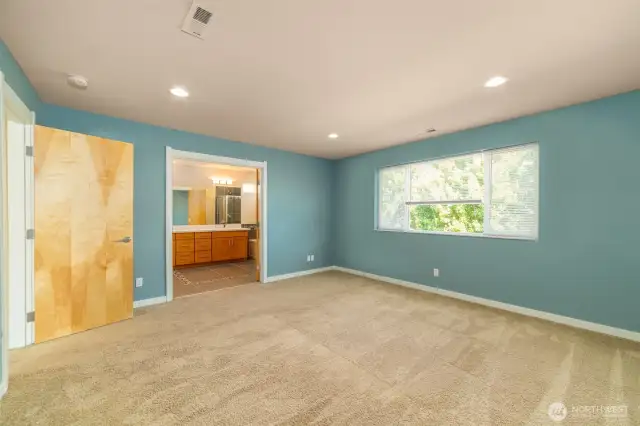 A spacious main primary suite is located on the second floor
