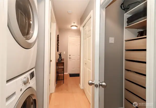 Hallway with laundry and storage