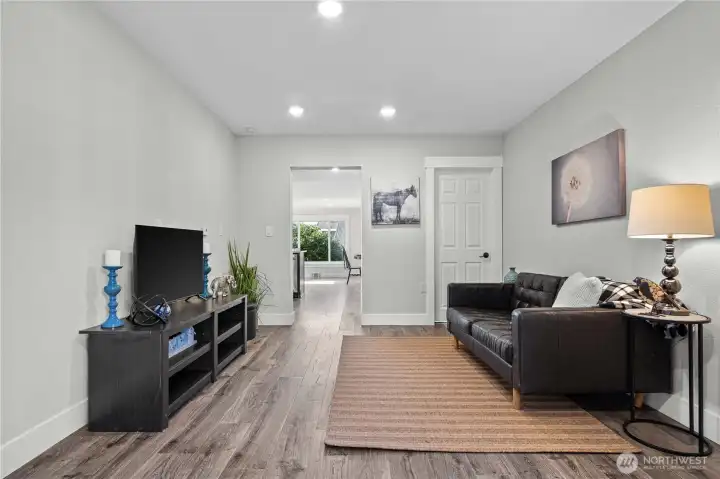 Family Room facing the Kitchen. Laminate Floors and Recessed Lighting keeps this area light!