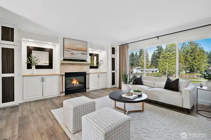 Spacious living room with great natural light through the large, front window.