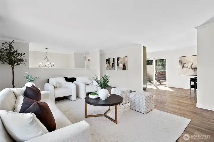 Open flow from living room room to dining, kitchen and deck areas.