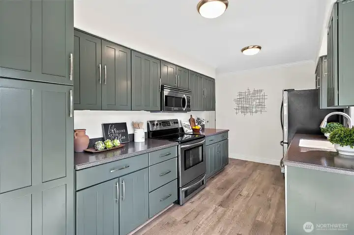 Refreshed, pewter green cabinets.