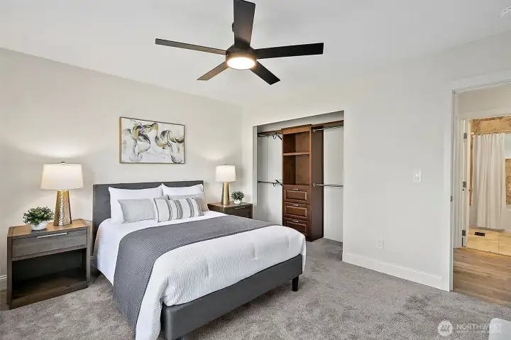 Closet system in primary bedroom provides wonderful additional storage functionality.