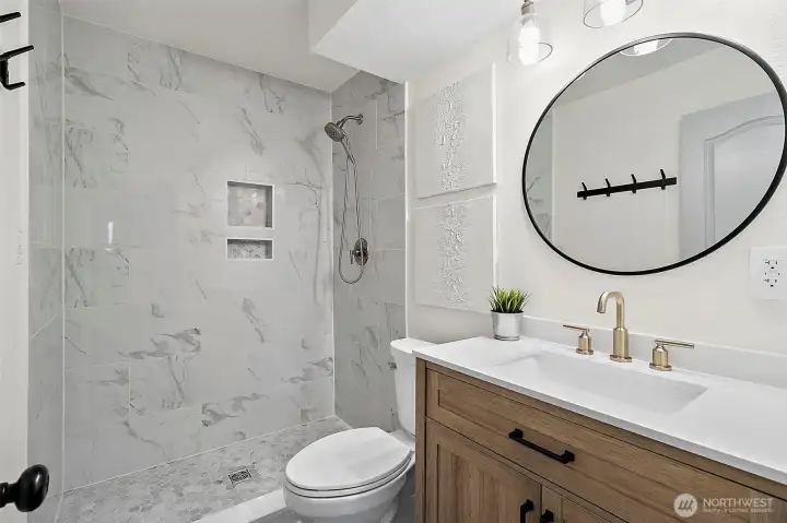 Updated 3/4 bathroom with tile shower, located downstairs.