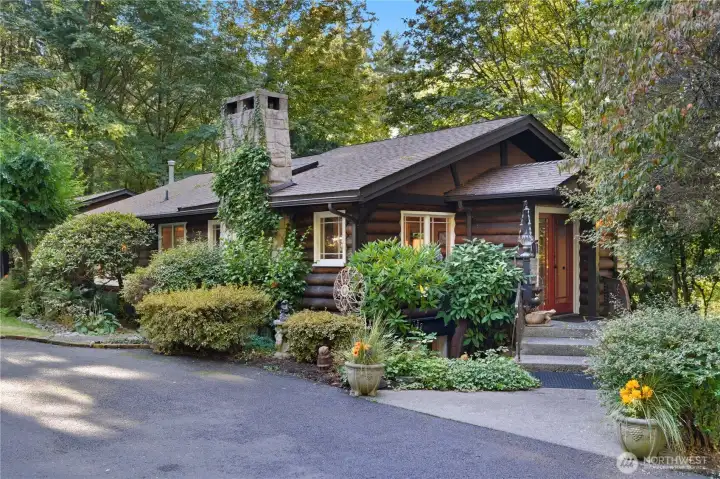Charming log-sided retreat tucked among towering trees with serene creekside setting. Come experience the private woodland escape!