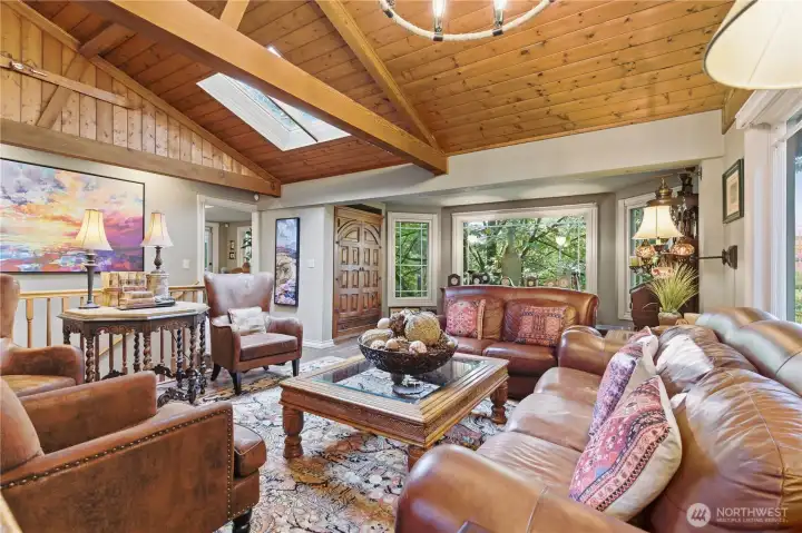 The abundance of windows and strategically placed skylight brings natural light and creates an ambience of being nestled in trees and nature.