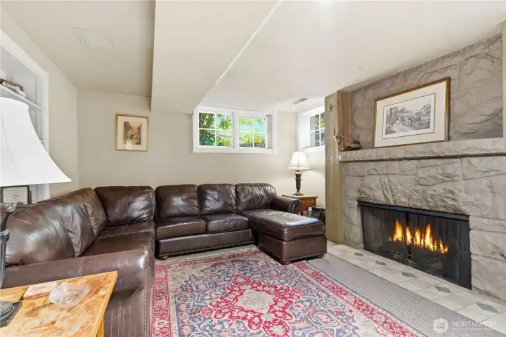 Lovely recreation room with cozy fireplace perfect for those chilly evenings.