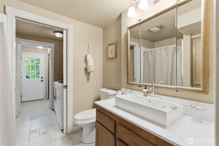 Guest bath on the lower level which serves the lower floor bedrooms and recreation room.