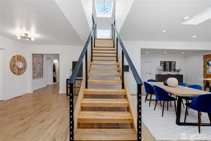 Stunning pine floating staircase with custom modern metal railings