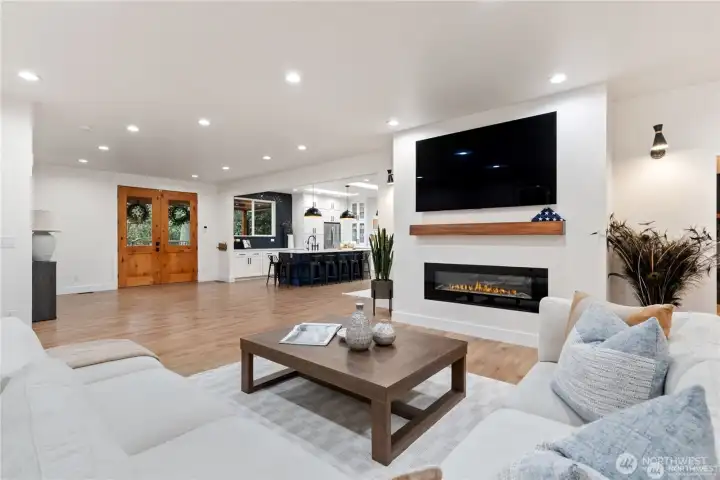View of family room into entry way and kitchen