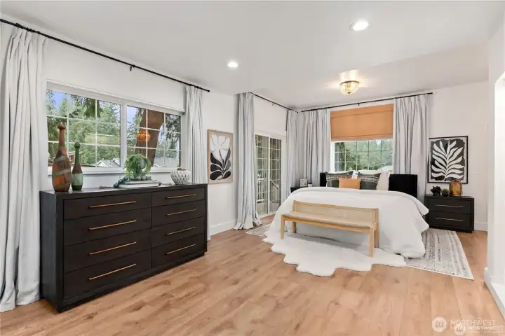 Primary suite on the main level very large and spacious with sliding door off to deck!