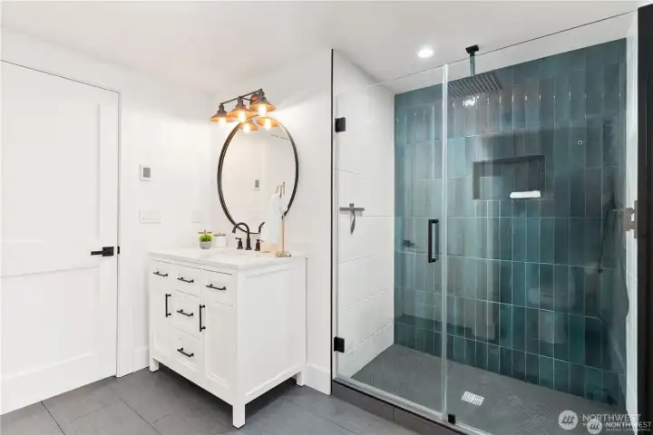 Three quarter bath on main floor with varient heated flooring! Stunning finishes and tile shower surround!