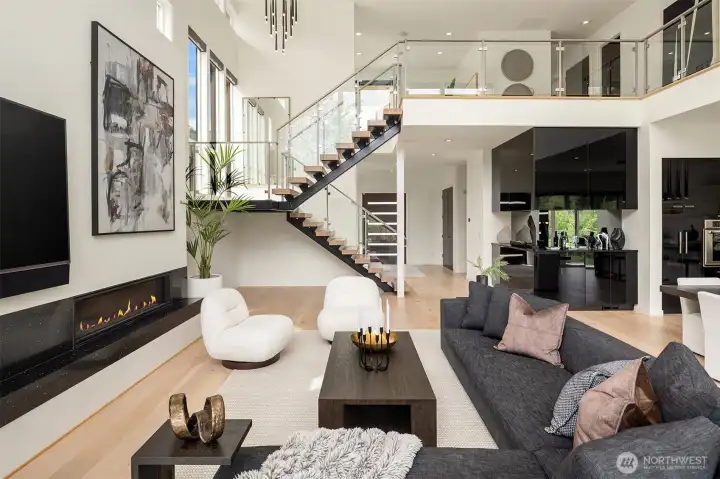 An architectural marvel with open spaces, framed by black granite counters and white oak floors