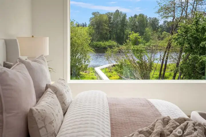 Enjoy the sunrise over the lake from your primary bedroom