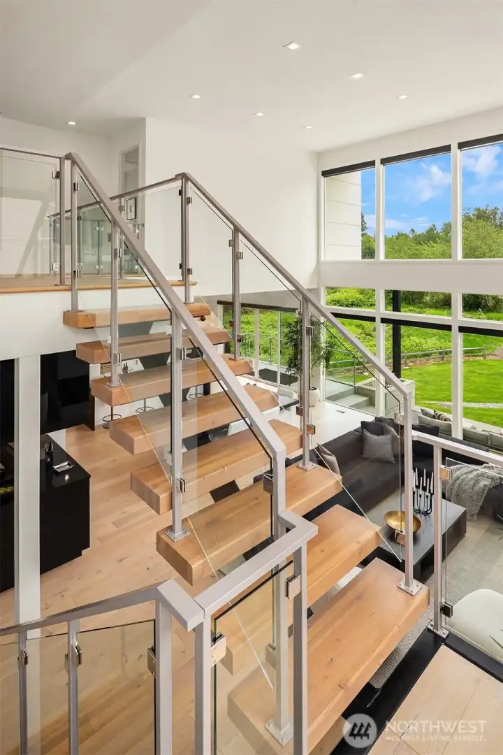 Floating Staircase with glass panels and steel handrails