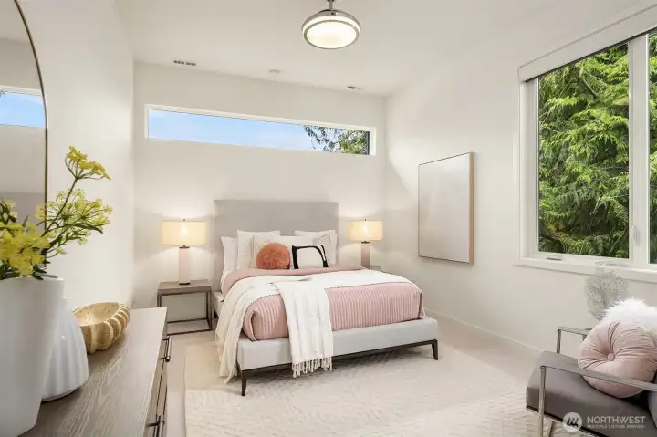 The third upper bedroom with an ensuite full bath