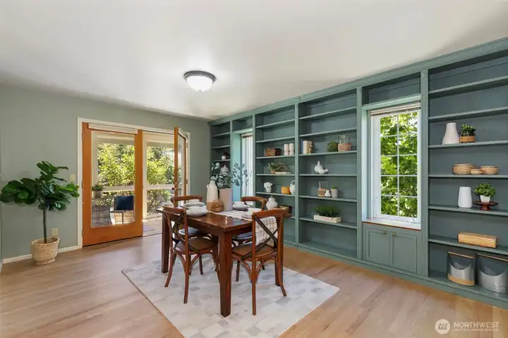 Dining with gorgeous craftsman style bookshelves. French doors to the sunroom.