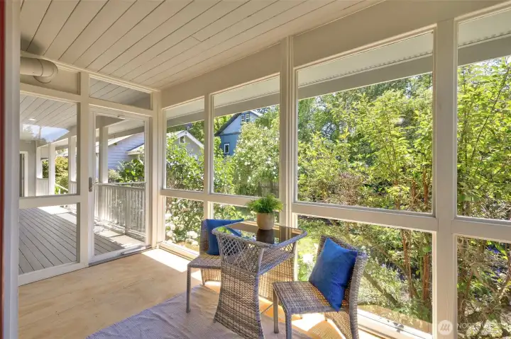 Sunroom and access to porch and backyard.