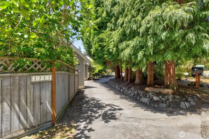 3/4 circle driveway for easy access to 2-car garage.