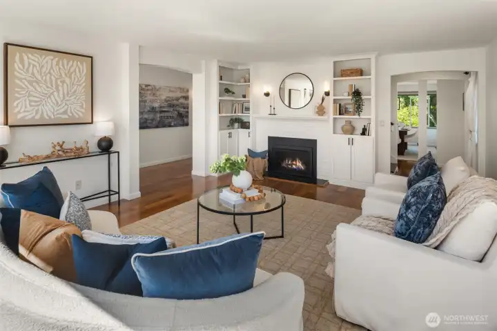 The built-in cabinets and bookshelves surround the gas fireplace for instant warmth and ambiance.