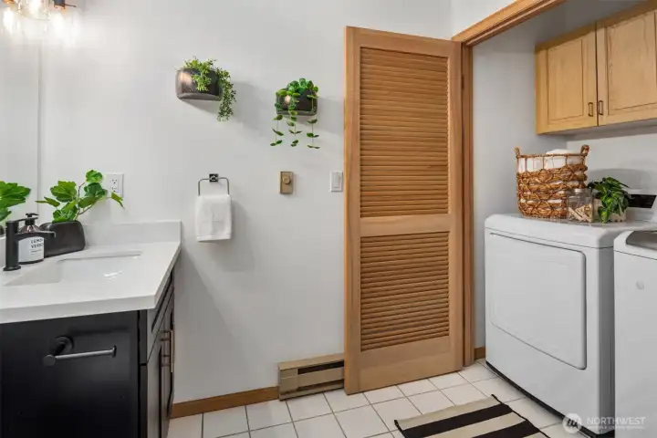 Just off the family room is this convenient powder room and full sized laundry.